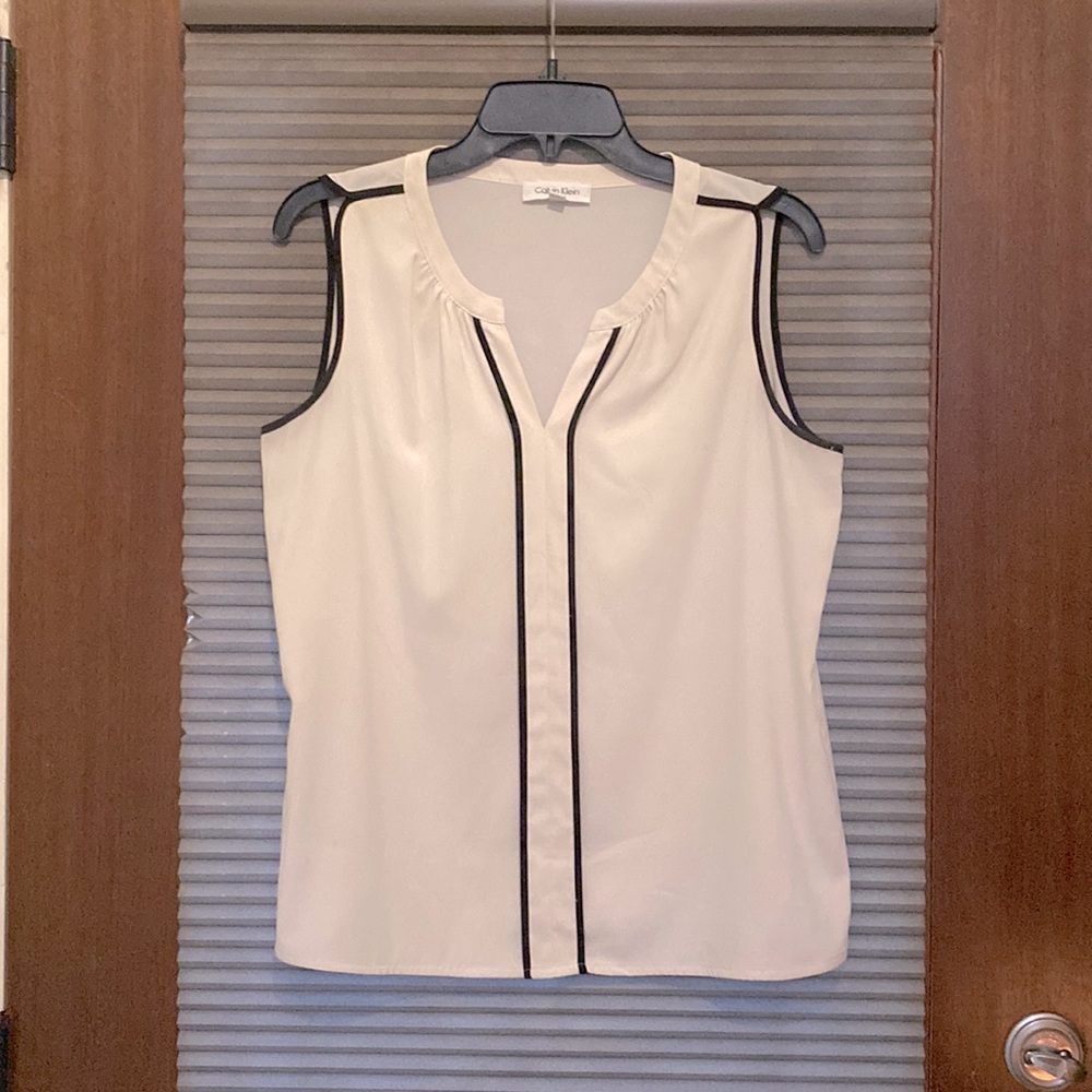 Lightweight Calvin Klein blouse. Material is 97% polyester and 3% spandex.